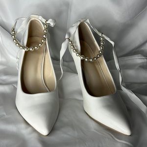 Adorable white heels, pearl ankle ties. Never worn!